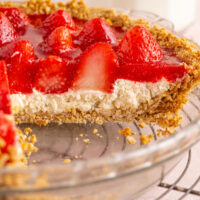 A strawberry pretzel pie with one slice removed, to reveal the layers.