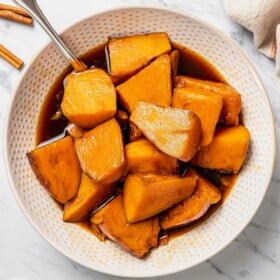 Camote con dulce with spiced piloncillo syrup in a bowl.