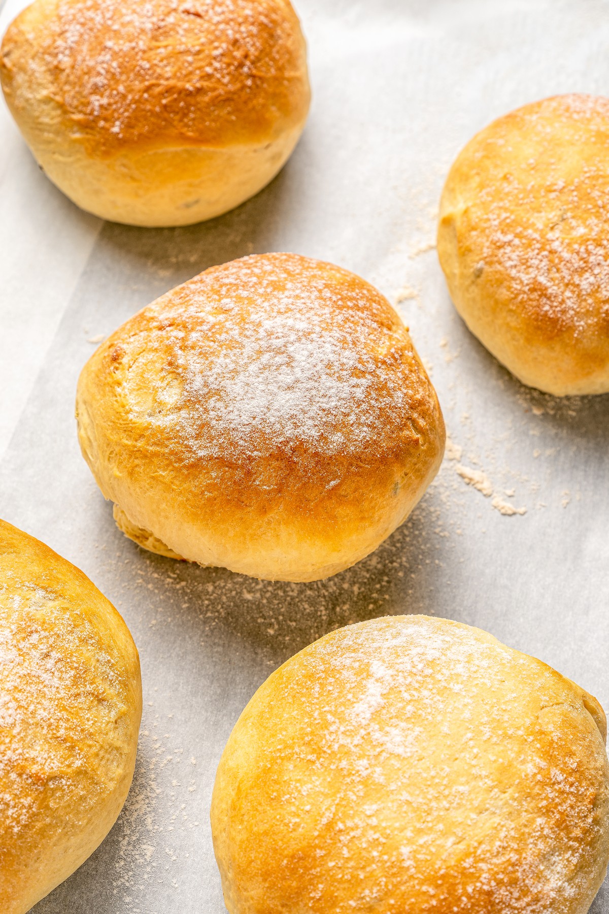 Close-up of cemitas on a baking tray.