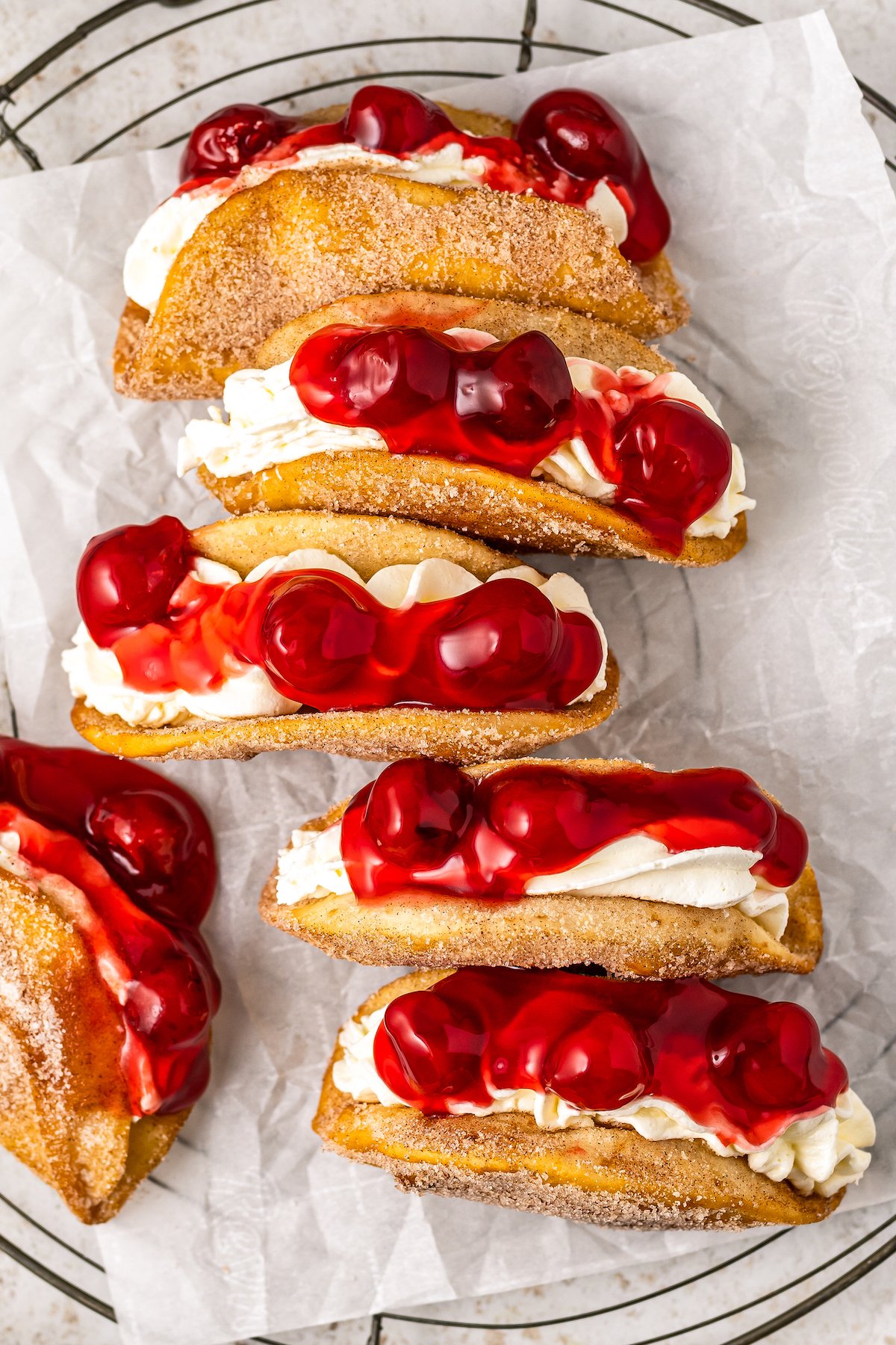 Cheesecake tacos on parchment paper. 