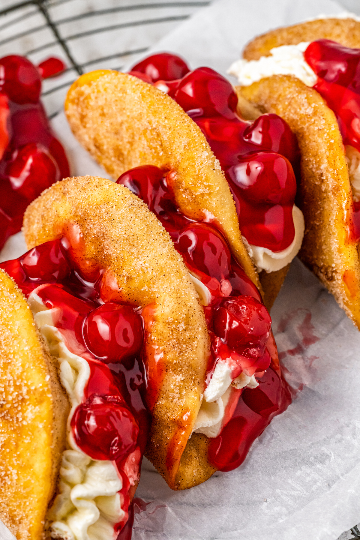 Close-up of cherry cheesecake tacos. 