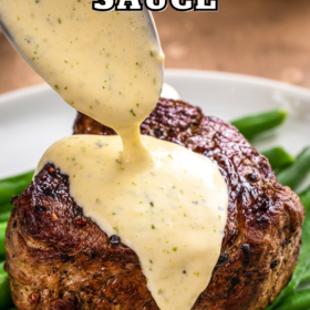 Béarnaise Sauce being drizzled on top of a steak.
