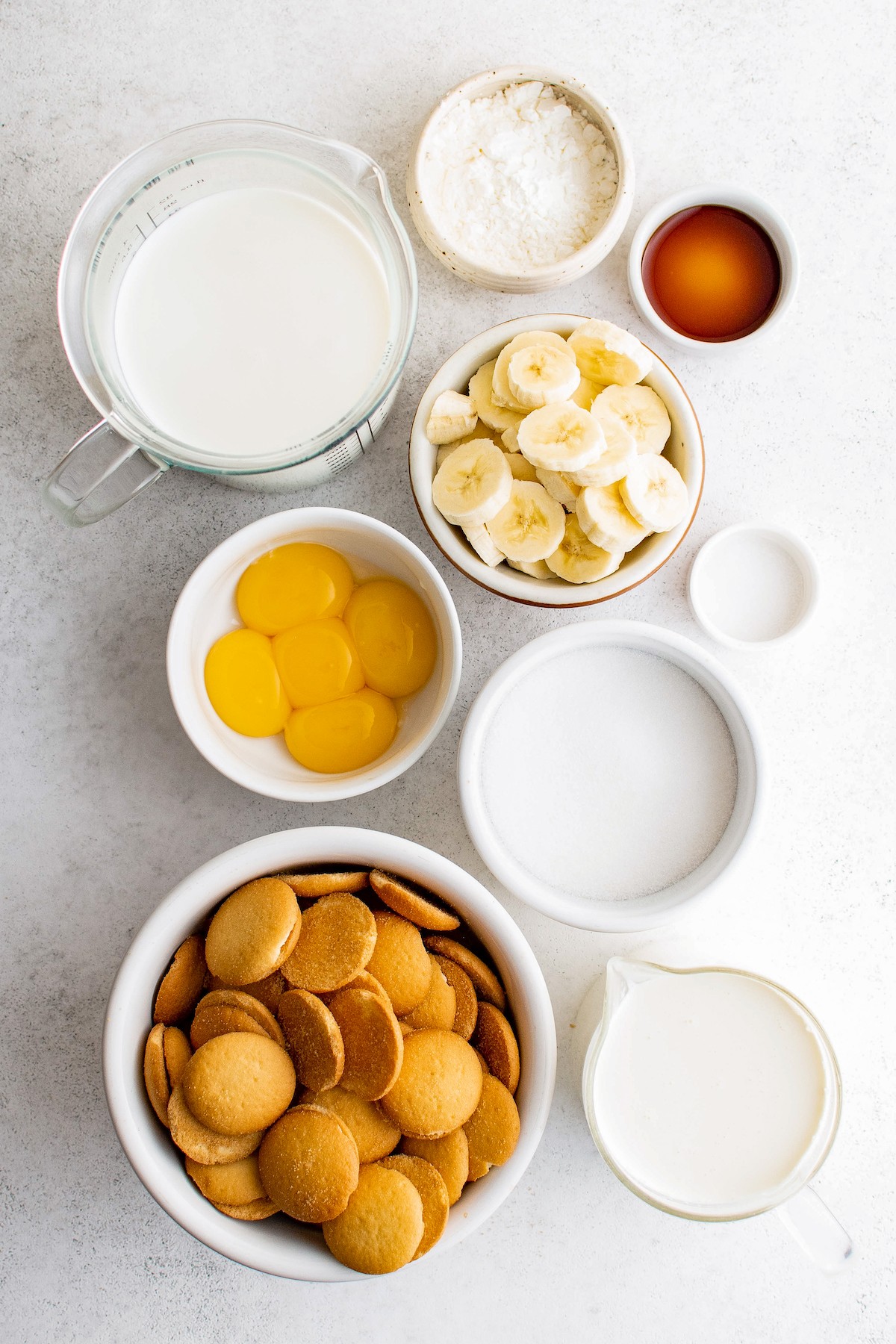 Banana pudding ingredients measured and arranged on a work surface.
