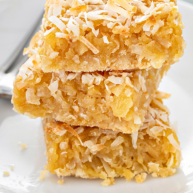 Pineapple coconut cookie bars on a plate.