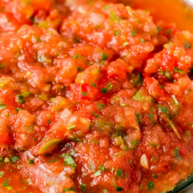 A jar of restaurant style salsa.
