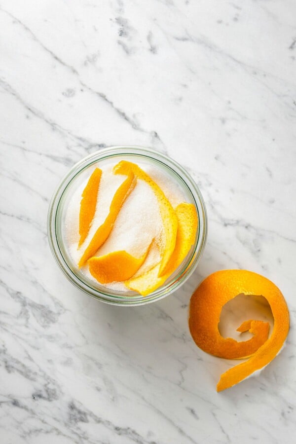Orange peel in a bowl of sugar.