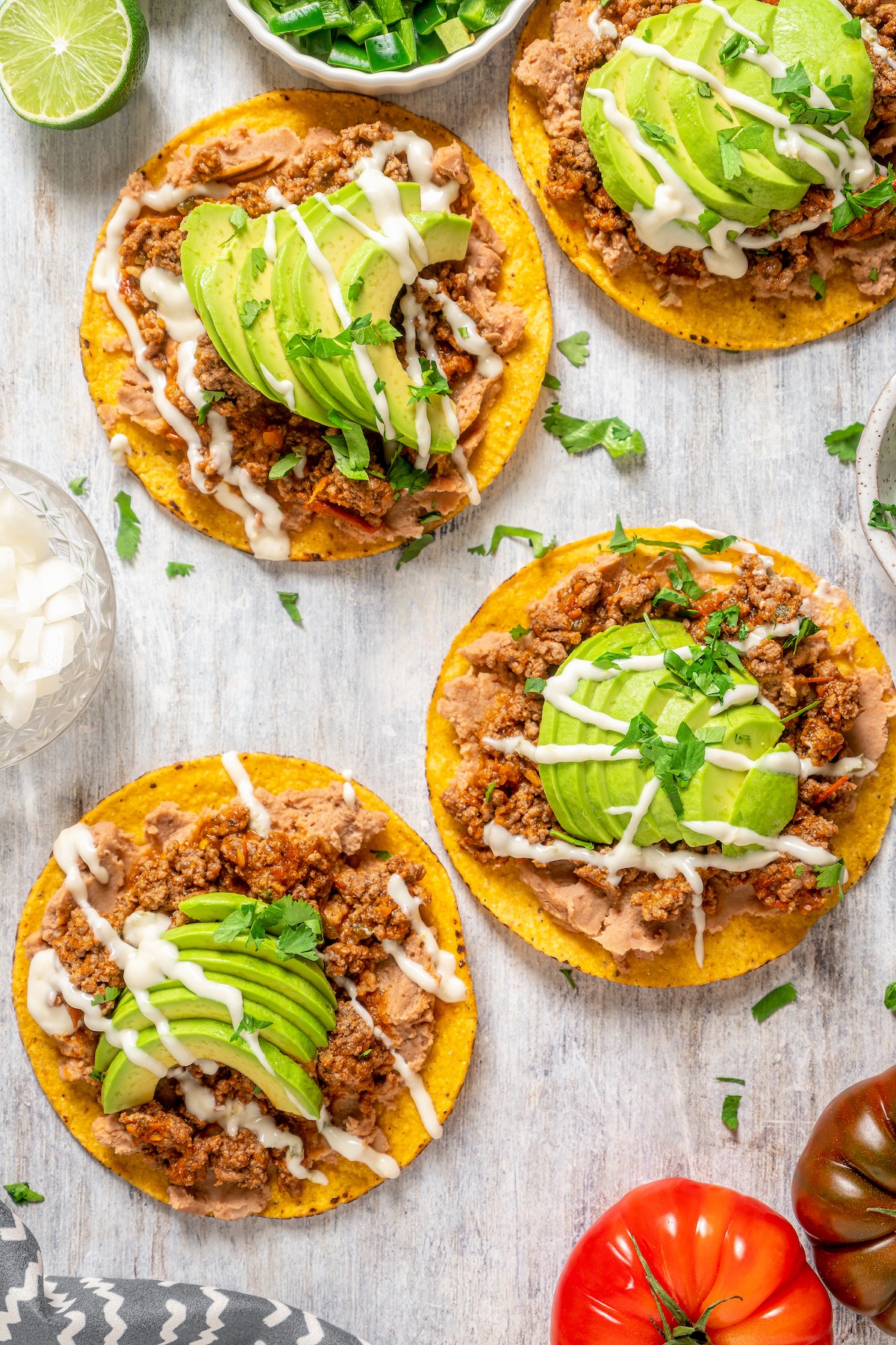 Carne molida tostadas with toppings.