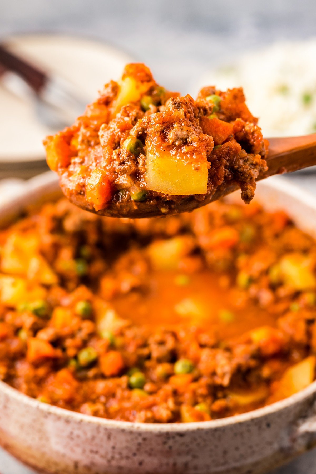 Picadillo on a wooden spoon. 