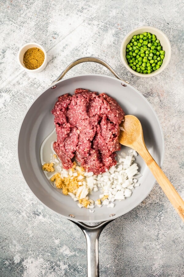 Cooking the ground beef.