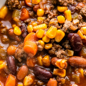 Slow cooker chili with corn and beans in a bowl.