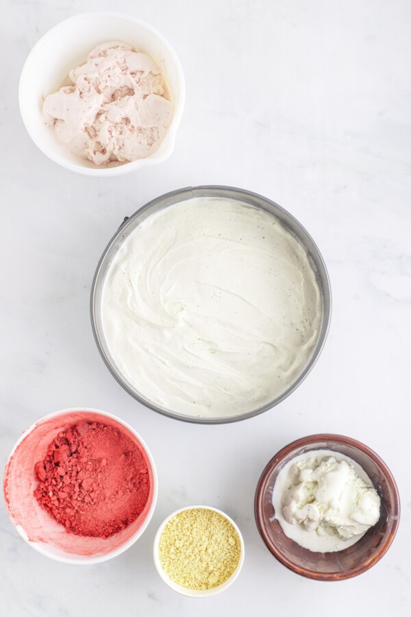 A vanilla ice cream layer in a springform pan.