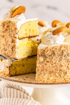 Lifting a slice of cake with a cake server.