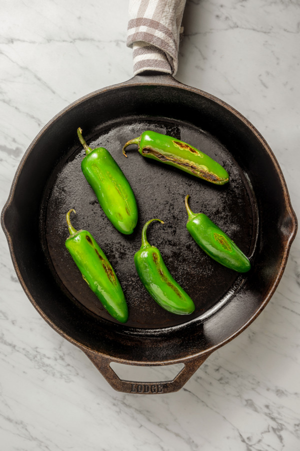 Charring the chiles in the pan.