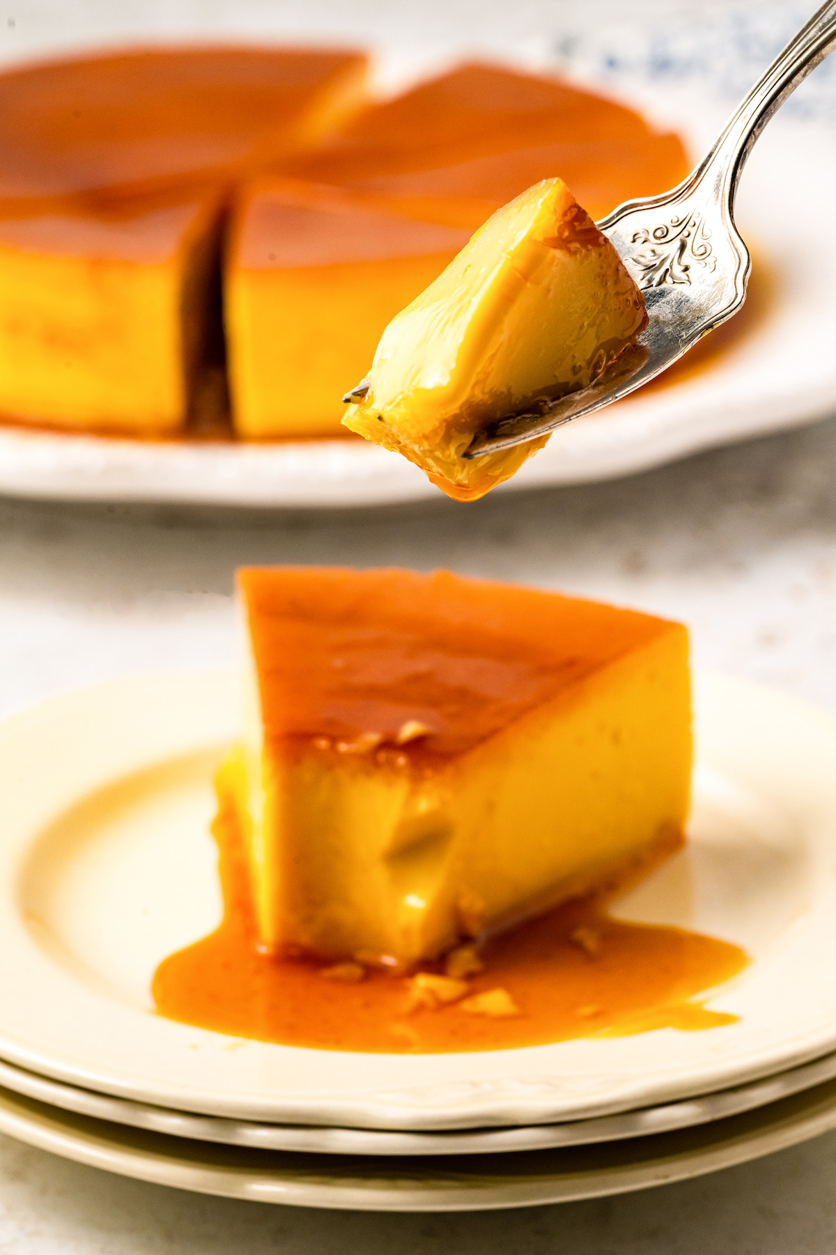 Spoonful of flan with caramel.
