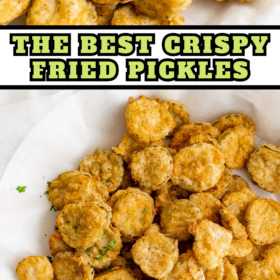 Fried pickles on a plate lined with parchment paper.