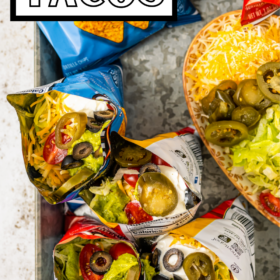 Bags of walking tacos on a metal serving tray.