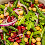 Three bean salad in a white bowl.