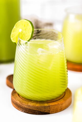 A glass of cucumber agua fresca.
