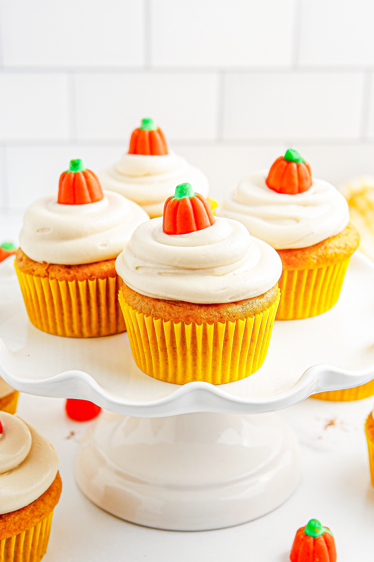 Easy pumpkin cupcakes on a cake stand.