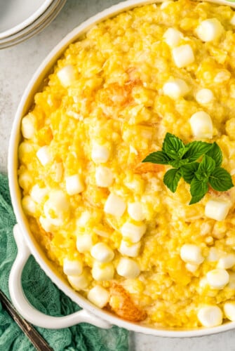 A dish of homemade frog eye salad with pineapple and marshmallows.