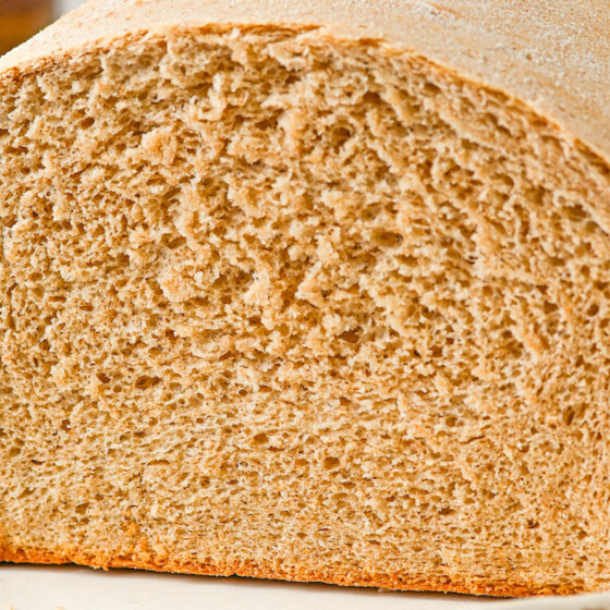 Landscape shot of a cut loaf of bread.