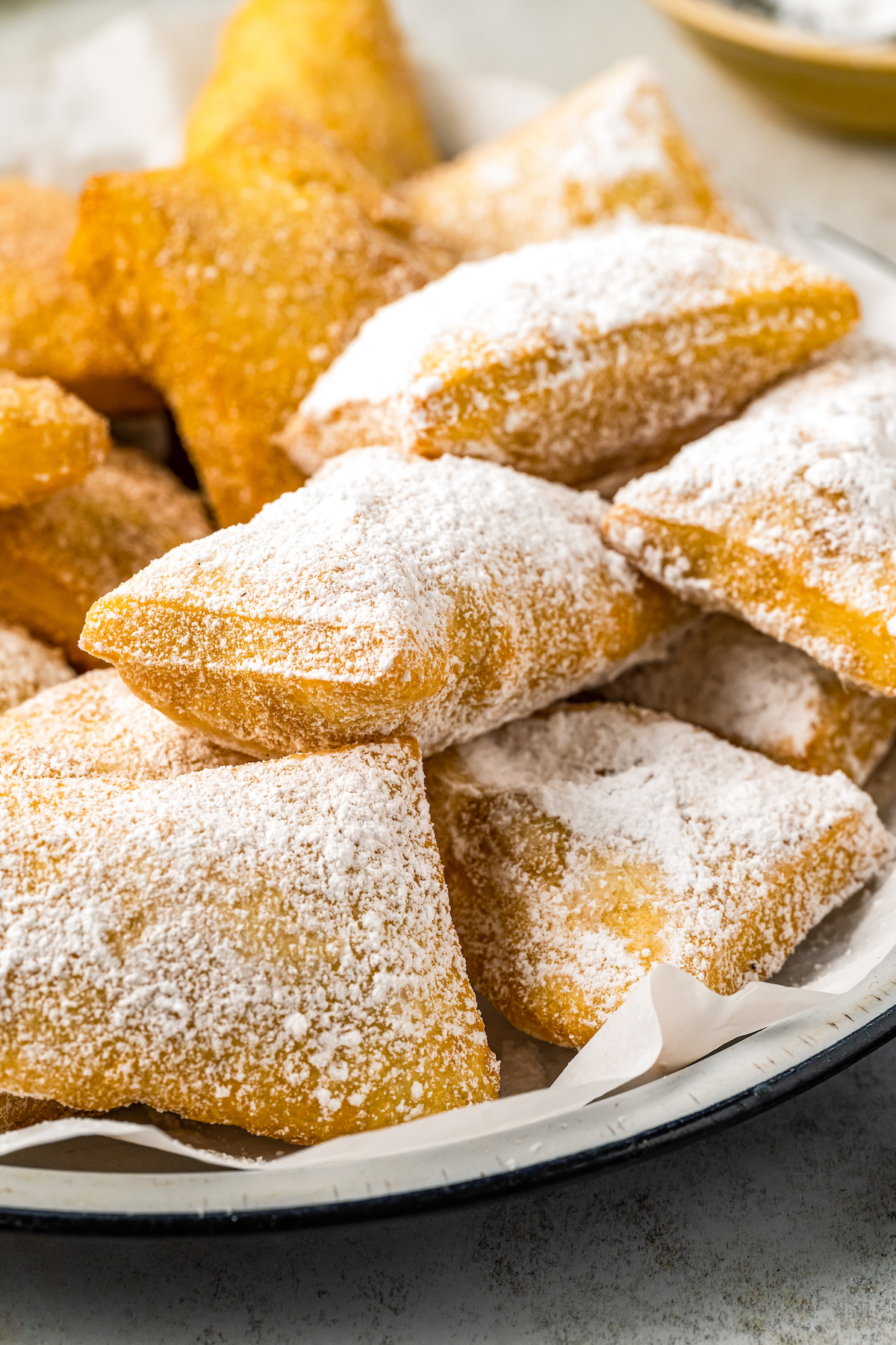Sopapillas dusted with powdered sugar. 