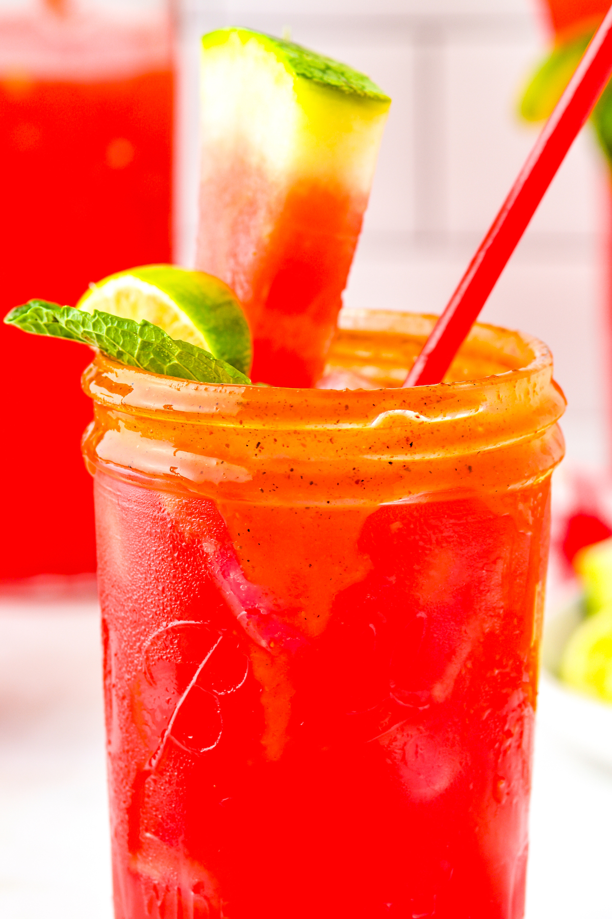 Close-up of watermelon agua fresca recipe with a watermelon slice as a garnish. 