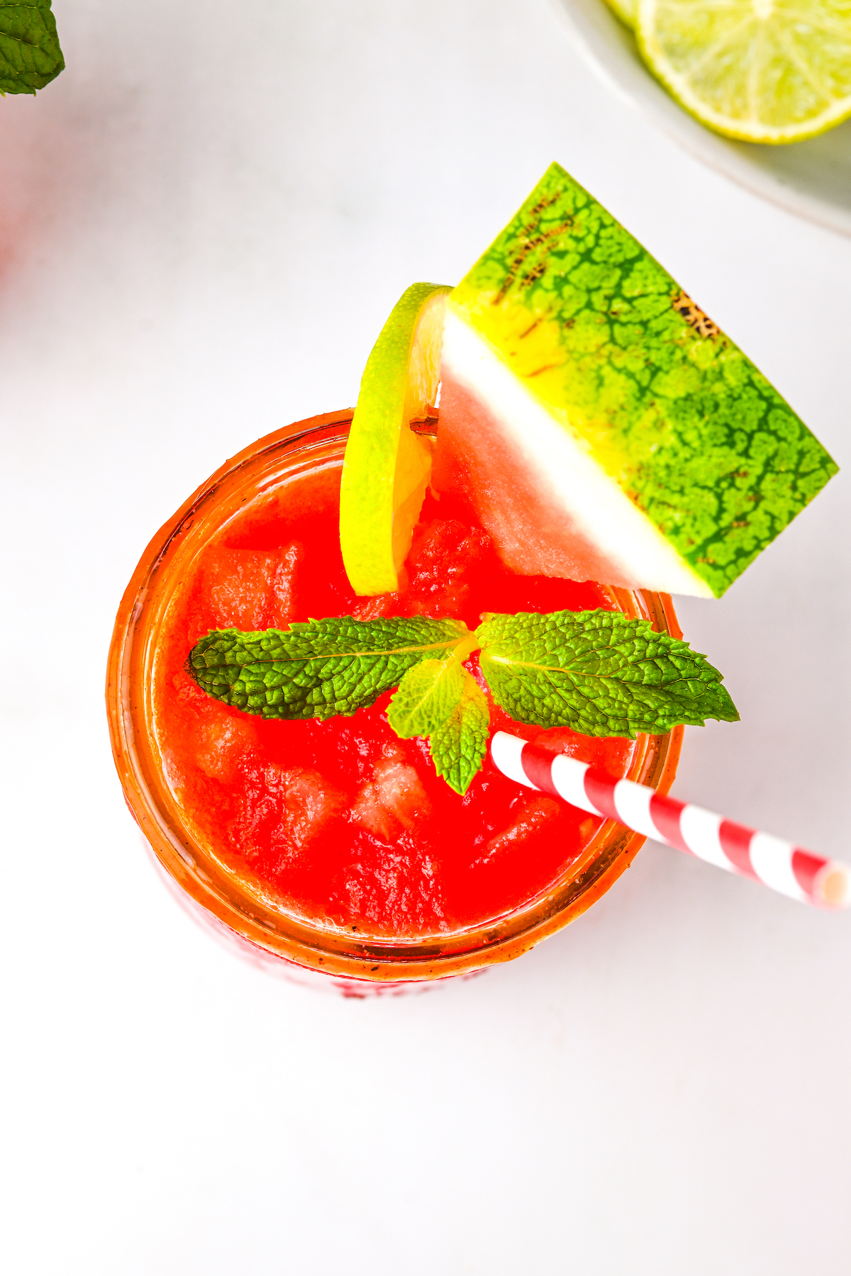 Overhead photo of watermelon agua fresca with a straw. 
