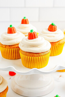 Easy pumpkin cupcakes on a cake stand.