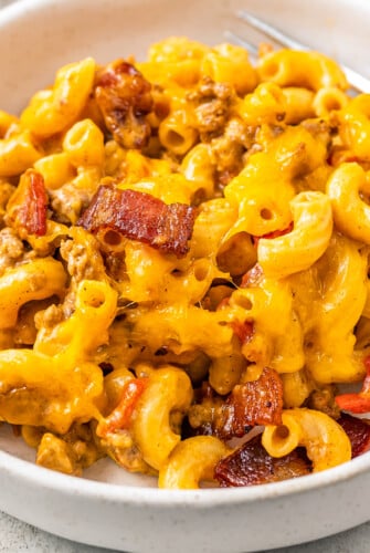 Cheesy macaroni with bacon and beef.