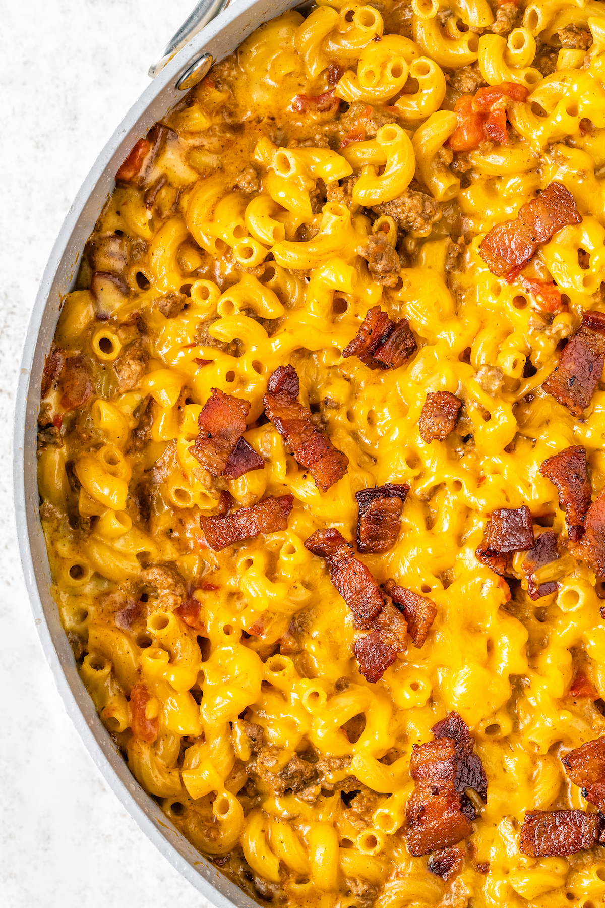 Cheesy macaroni in a skillet.