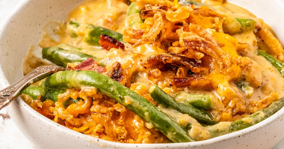 Cheesy green bean casserole topped with french fried onions.