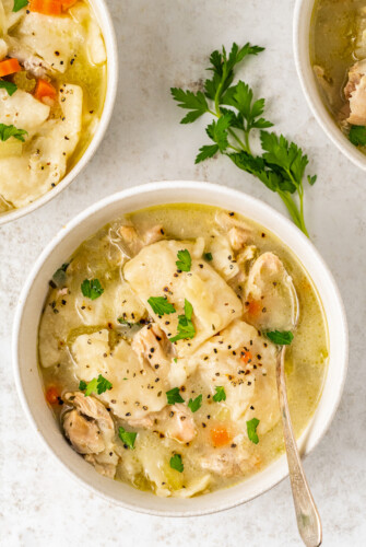 Overhead shot of flat dumplings and chicken soup.