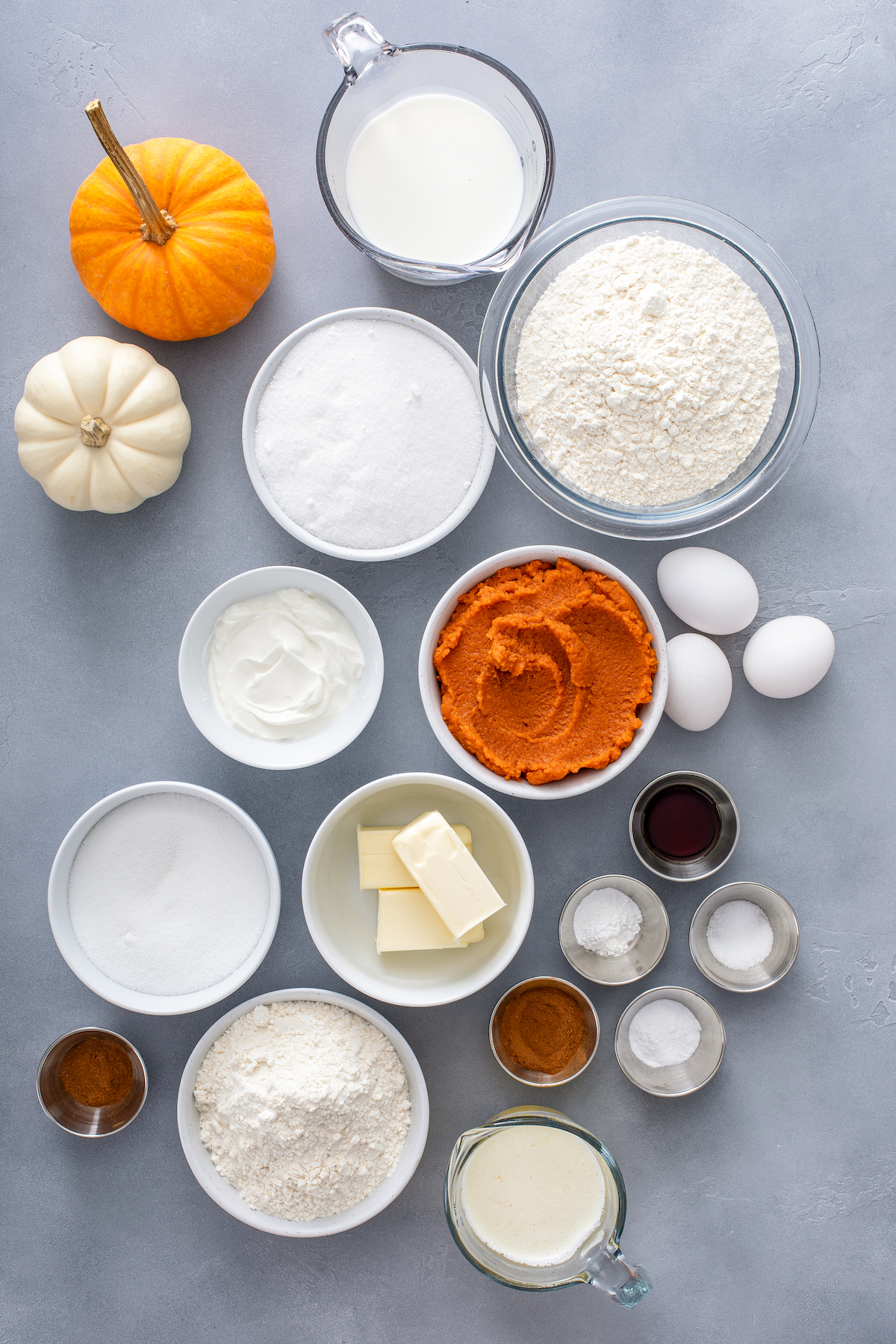 Ingredients for pumpkin coffee cake, arranged on a work surface.