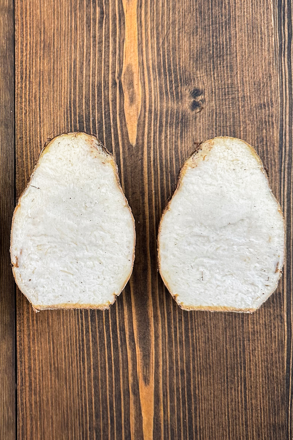 Taro Root sliced in half to show the inside.