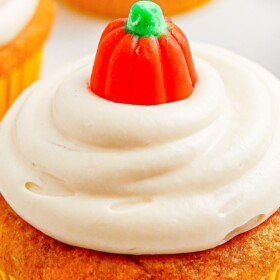 Pumpkin cupcake with cream cheese icing.