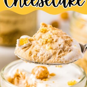 No Bake Peanut Butter Cheesecake with a spoon scooping up a bite.