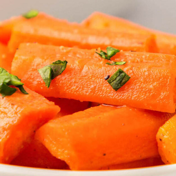Cut carrots are roasted with a sprinkling of parley
