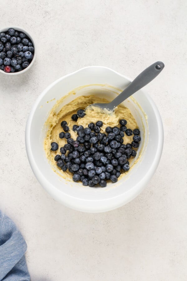 Pound Cake batter in a bowl with blueberries folded in.