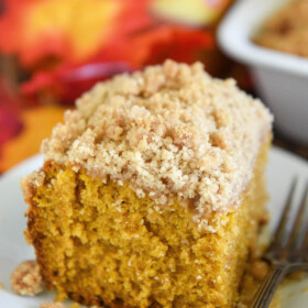 A slice of pumpkin sour cream coffee cake with a cinnamon crumb topping.