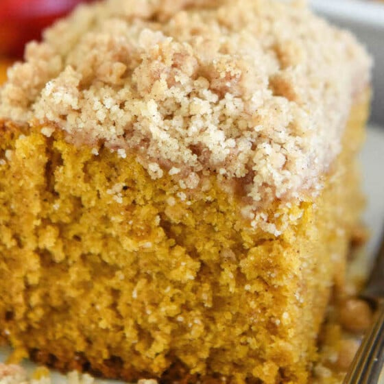 Pumpkin sour cream coffee cake on a plate with a fork.