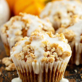 Pumpkin streusel muffin drizzled with cream cheese icing.