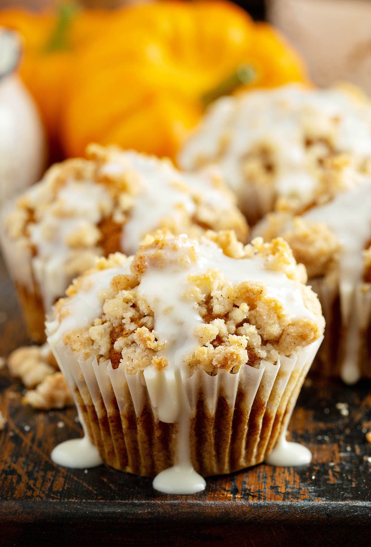 Pumpkin streusel muffin drizzled with cream cheese icing.