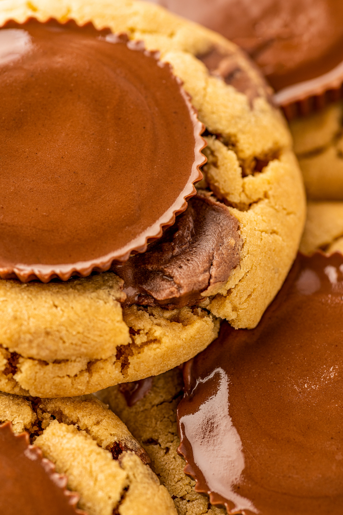 Close up of the melty peanut butter cup on top of a peanut butter cup cookie.