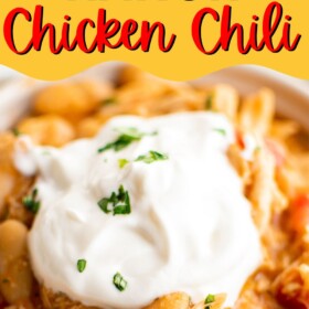 A bowl of white bean chicken chili with sour cream on top.