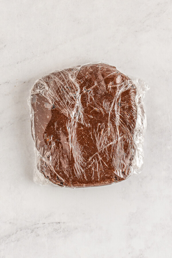 Brownie dough wrapped in plastic wrap. 