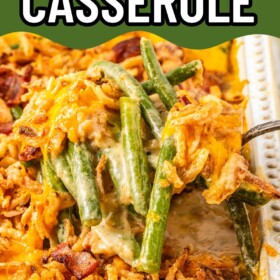 A spoon scooping out a serving of green bean casserole with cheese.