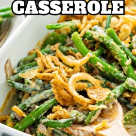 A wooden spoon scooping a serving of green bean casserole out of a baking dish.