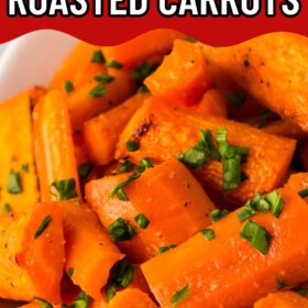 Roasted carrots with honey in a bowl with fresh parsley sprinkled on top.
