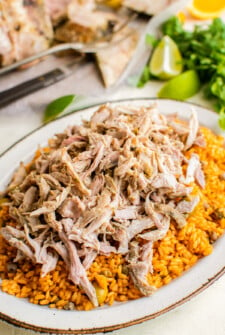A serving of arroz con gandules y pernil on a plate.